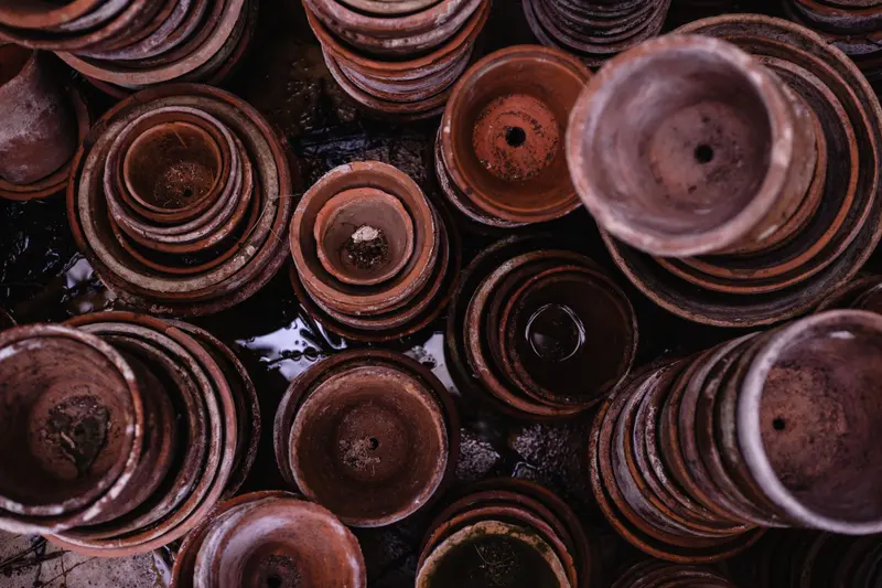 Terracotta flowerpots stacked inside each other, seen from above.