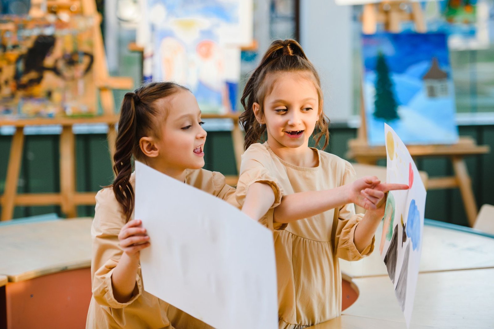 Children sharing their artwork in class