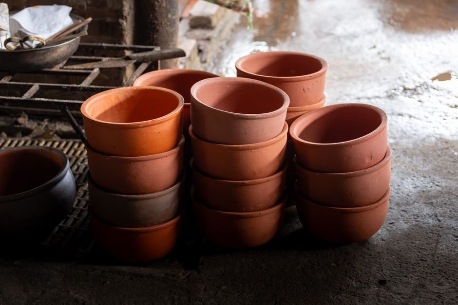 Stack of terracotta pots in a traditional pottery workshop