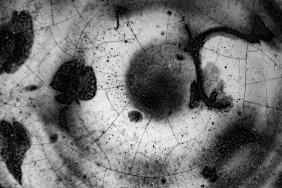 Close-up of a cracked, crawled glaze surface texture on a fired ceramic piece
