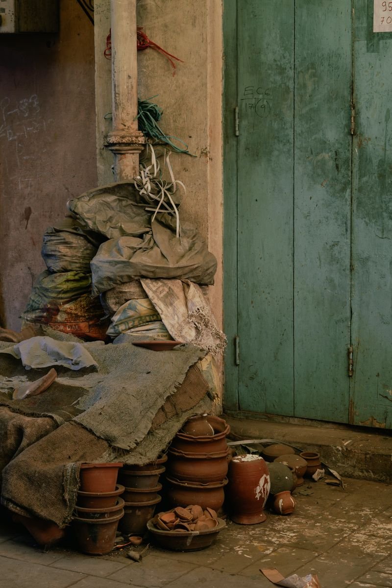 Stacked bags of clay in a pottery studio