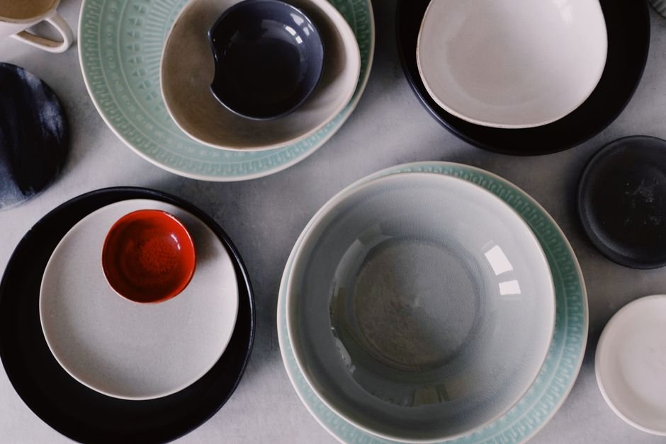Handmade ceramic mugs drying before their final glaze firing