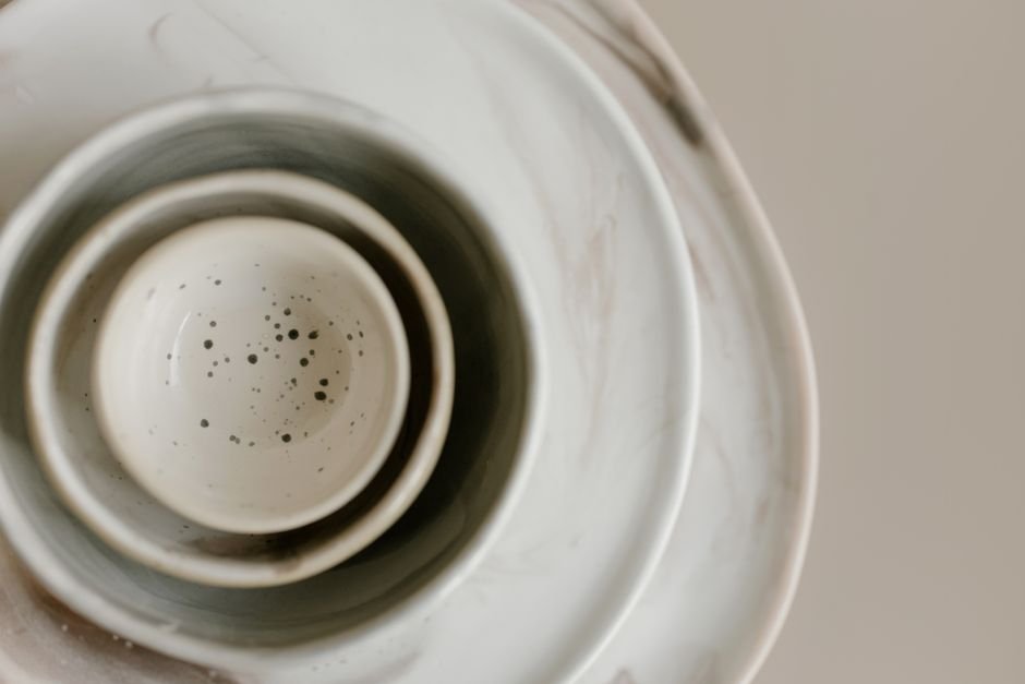 Stacked white ceramic bowls with a minimalist glossy glaze finish