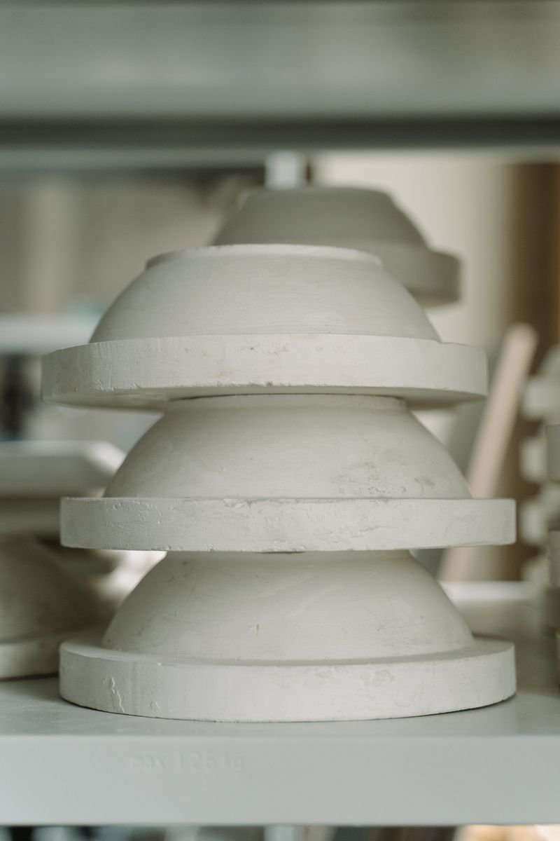 Finished glazed pottery on a kiln shelf