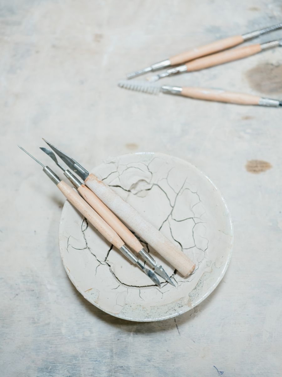 Set of pottery clay carving tools laid out together