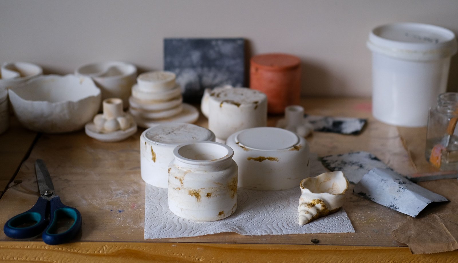Ceramic tools arranged on a workbench for fine detail work