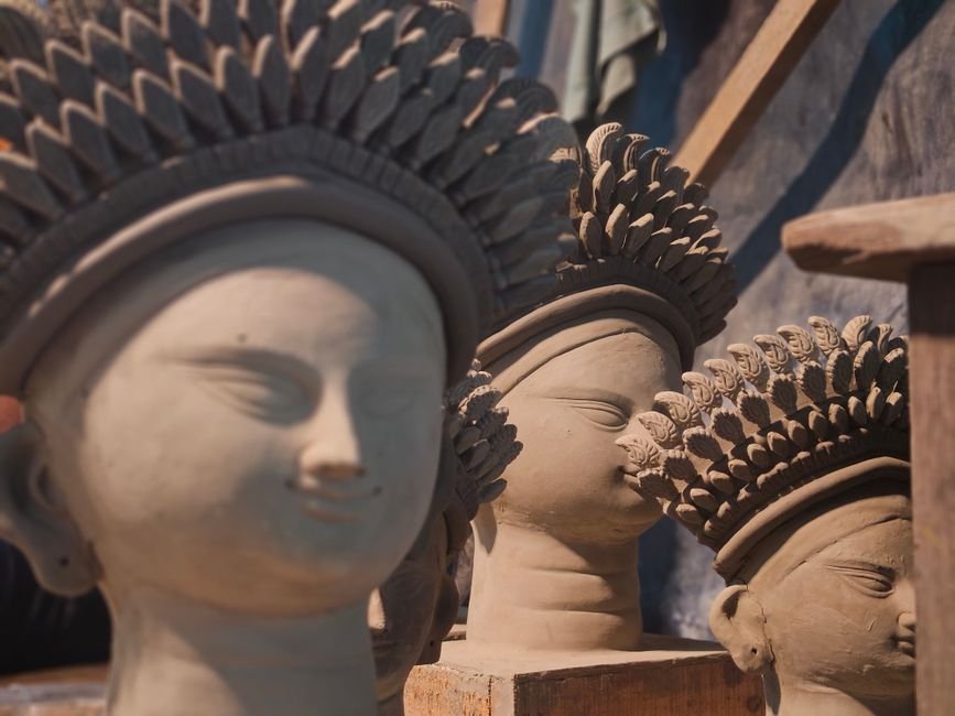 Clay sculptures with detailed headpieces, the kind of work found among ceramic sculptures for sale