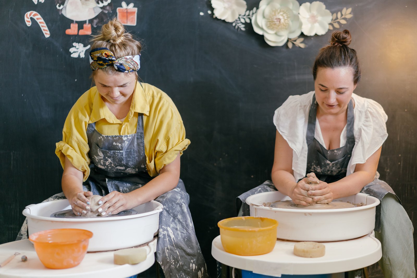 Potters working together in a shared ceramic studio space