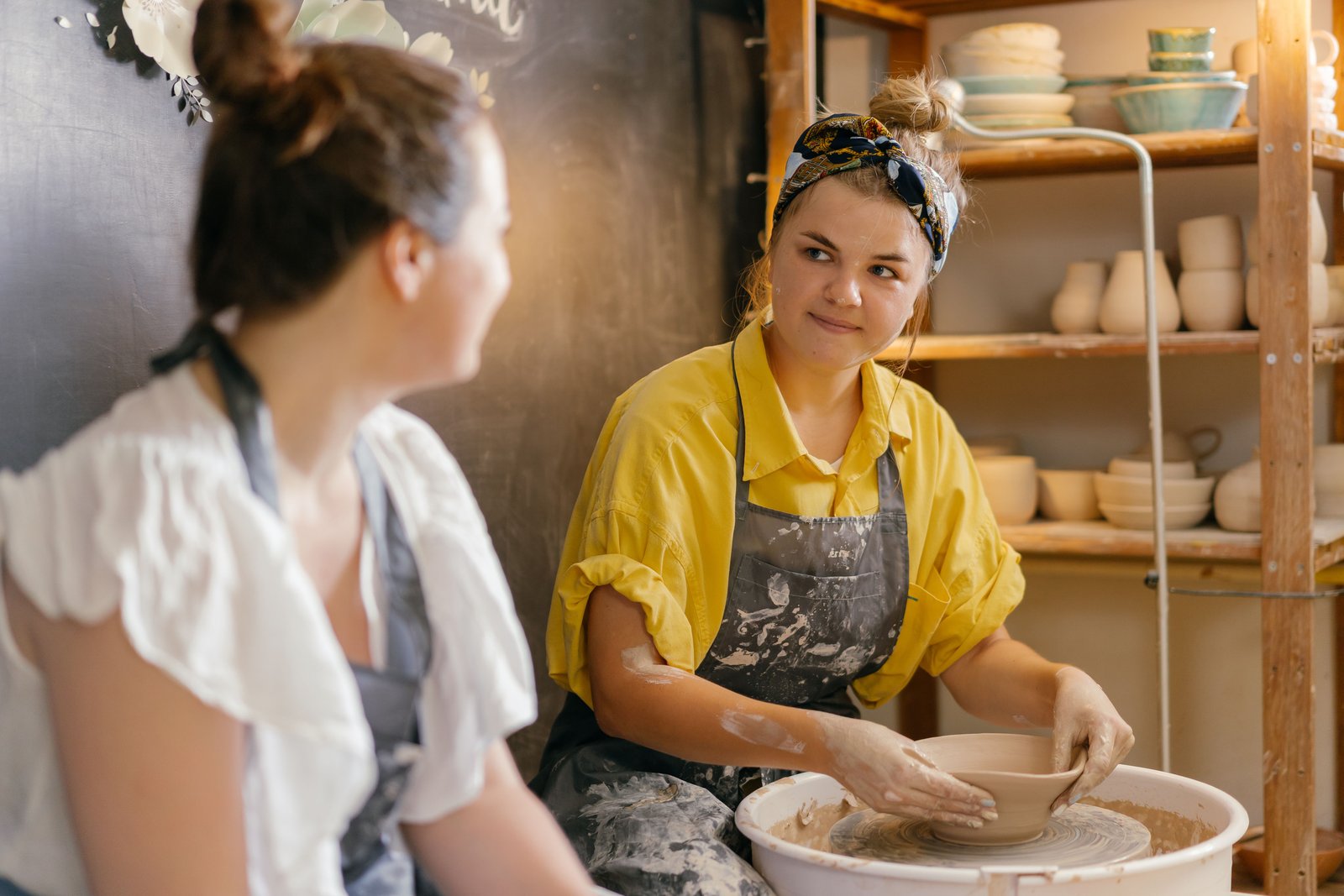 Person wearing comfortable practical clothing for a pottery class