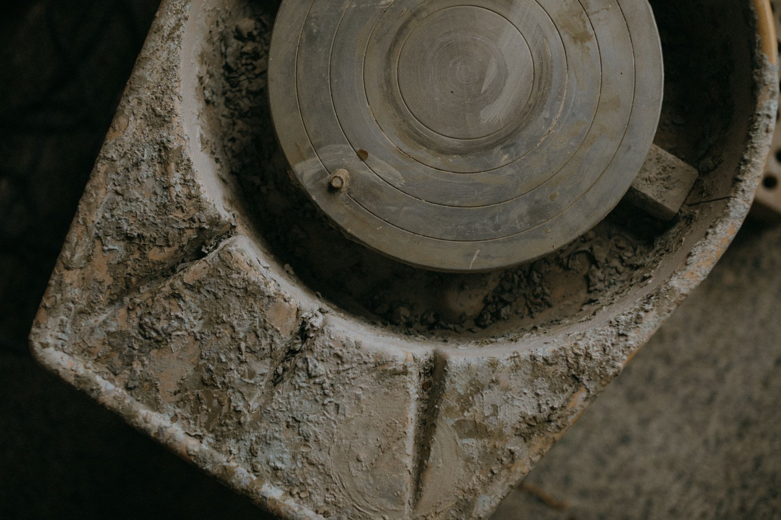 Close up texture of a rustic clay covered pottery wheel