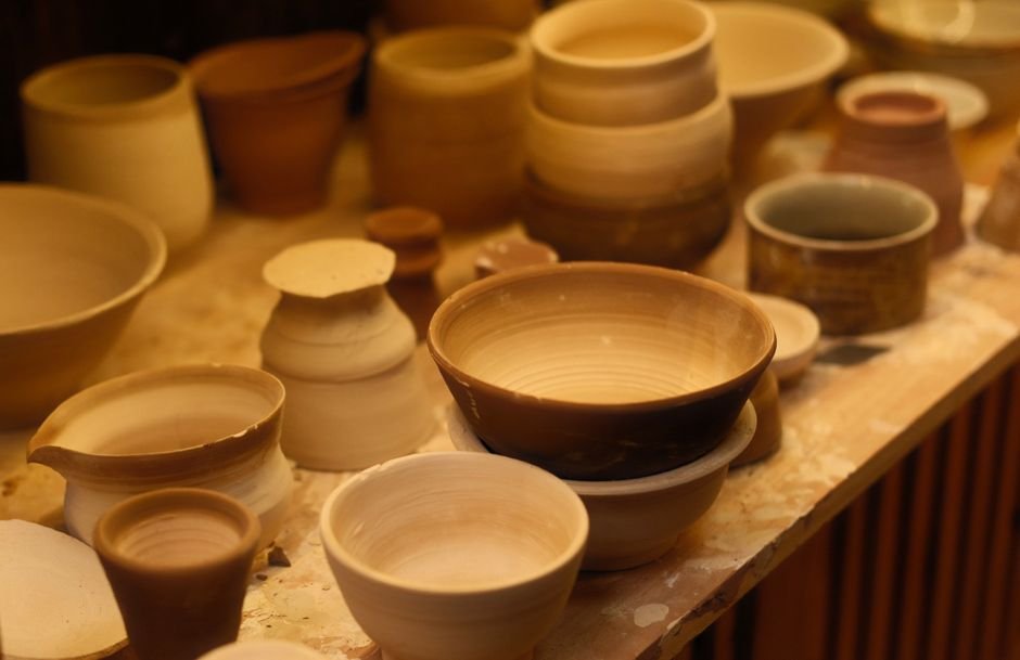 Collection of handcrafted ceramic bowls in a pottery studio, a set inspired by wheel pottery ideas